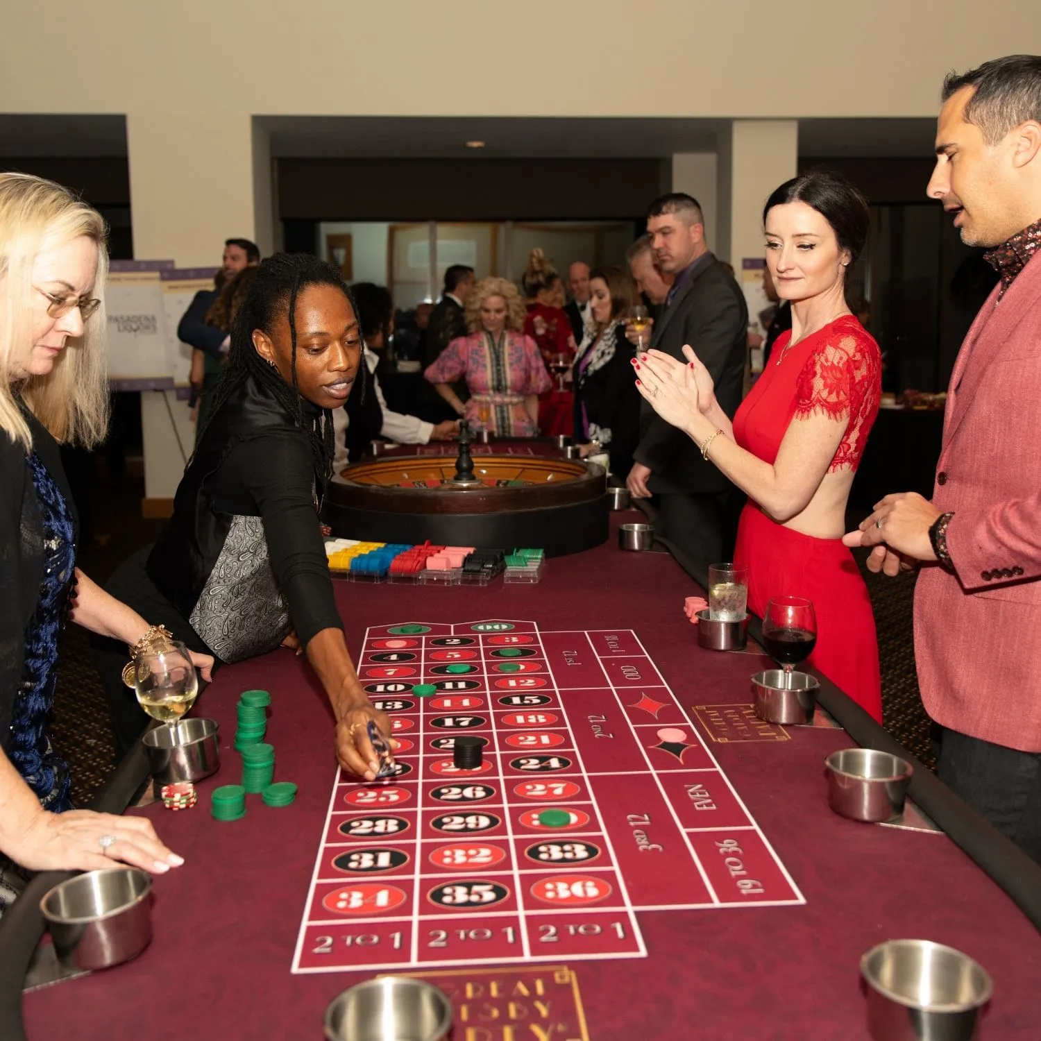 Guests gathered around the roulette table