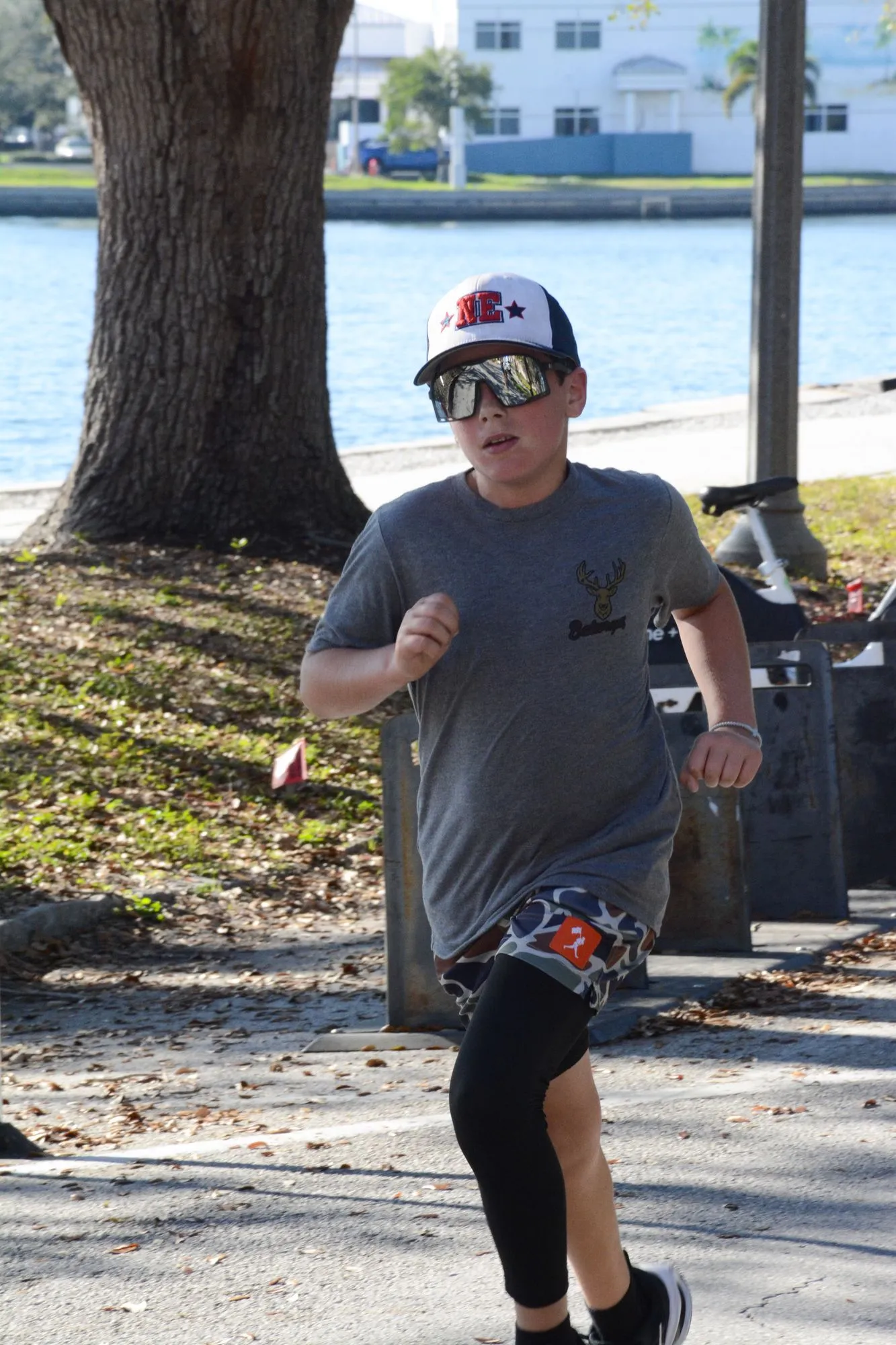A boy running along the waterfront path during the 2026 Legacy Run